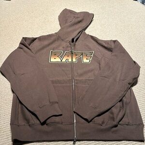 Bape brown kiss logo zip up sweater
Never worn